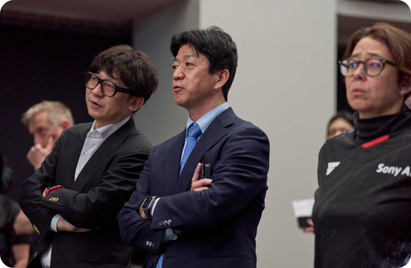 Victas, an official athletic partner watching a match. 